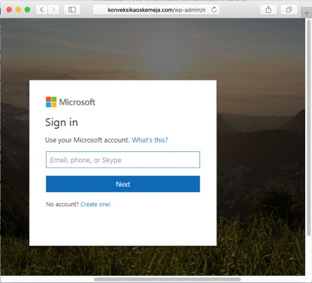 A fake Microsoft login page is presented by the link.