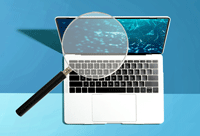Magnifying glass over a laptop screen