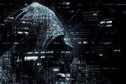 Mysterious hacker in black hood