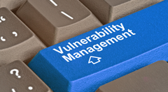 Keyboard key labelled Vulnerabilty Management