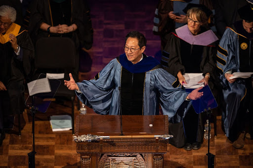 President Santa Ono standing at a podium speaking at his inaugural address at the University of Michigan.