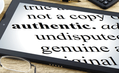 The definition of word "authentic" on a tablet with glasses in the foreground. Authentic by Nick Youngson CC BY-SA 3.0 Alpha Stock Images
