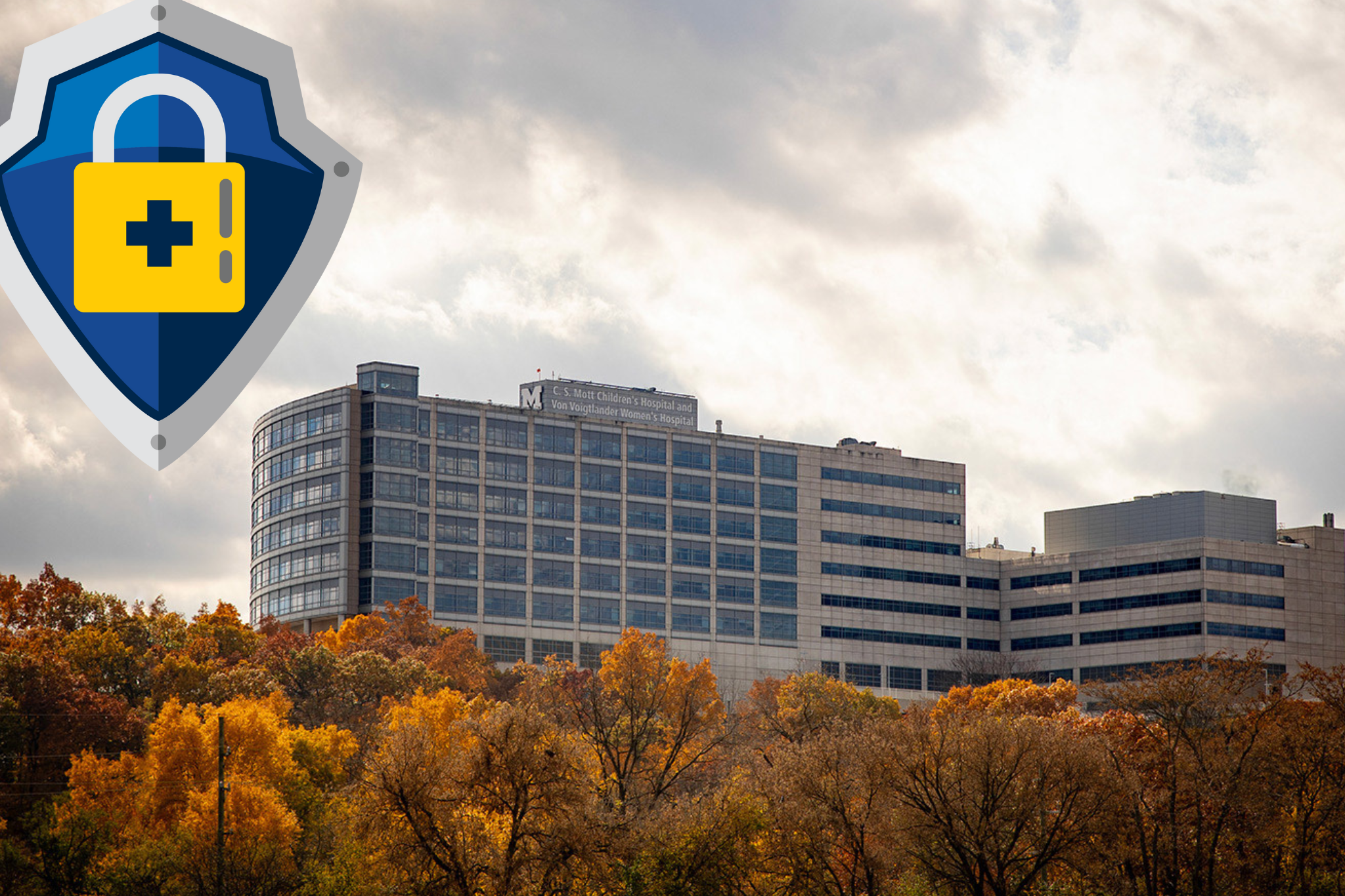 Icon of shield and lock superimposed over University Hospital, its buildings surrounded by beautiful autumn foliage.